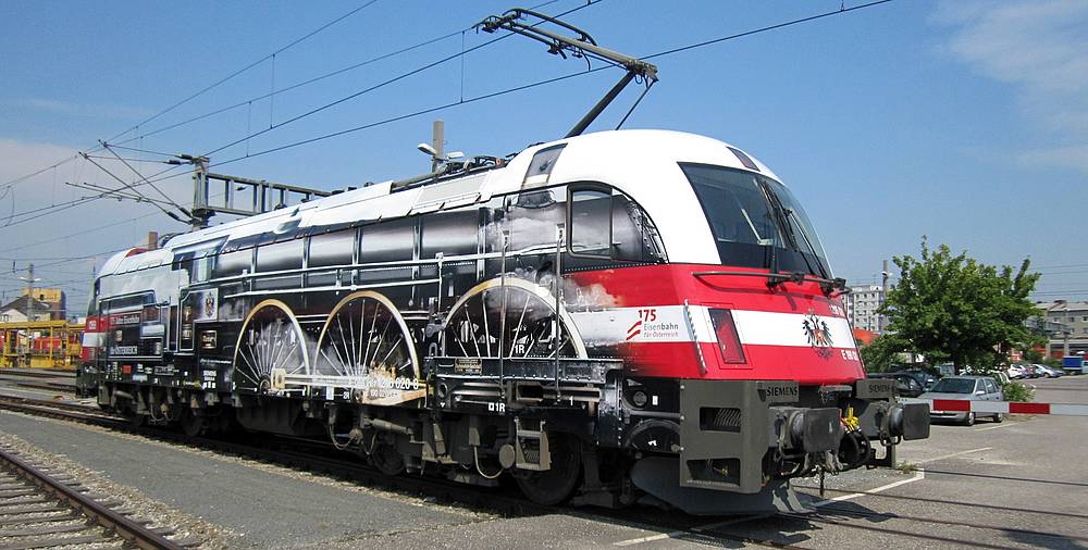 csm_Eisenbahn-Jubilaeumstaurus-_E-Lok-Rh-1216_6029c60060